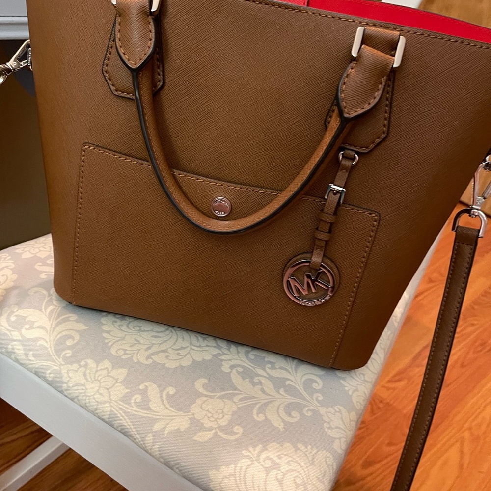 Authentic Michael Kors tote style purse with strap.